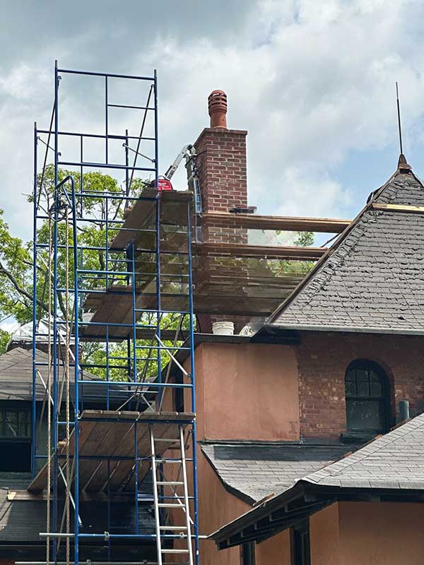 Chimney repair with scaffolding