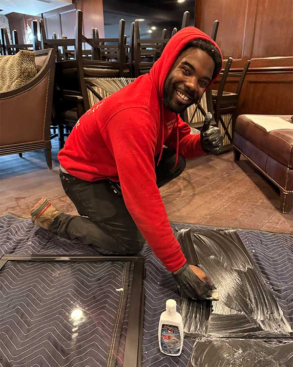 Technician cleaning a fireplace