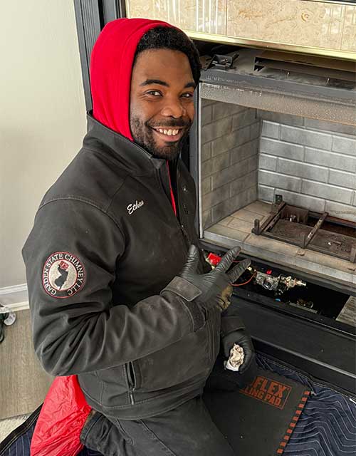 Technician repairing fireplace